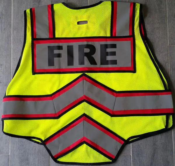 Yellow fire safety vest with reflective striping.